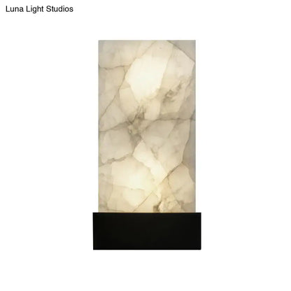 A sleek rectangular onyx wall sconce with glowing white interior and gray veining for e26 e27 light use