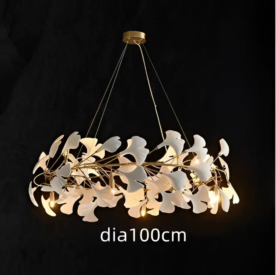 A modern white orchid decorbites ginkgo chandelier with delicate white ginkgo leaves and gold-toned ceiling mount
