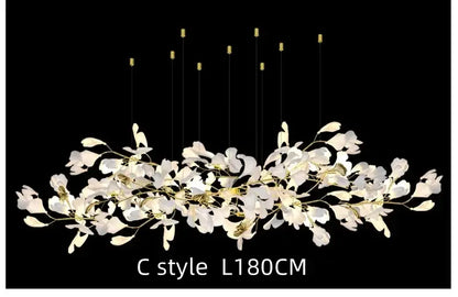 White orchid decorbites ginkgo chandelier with gold-toned accents and slender wires in a c-style living room pendant light