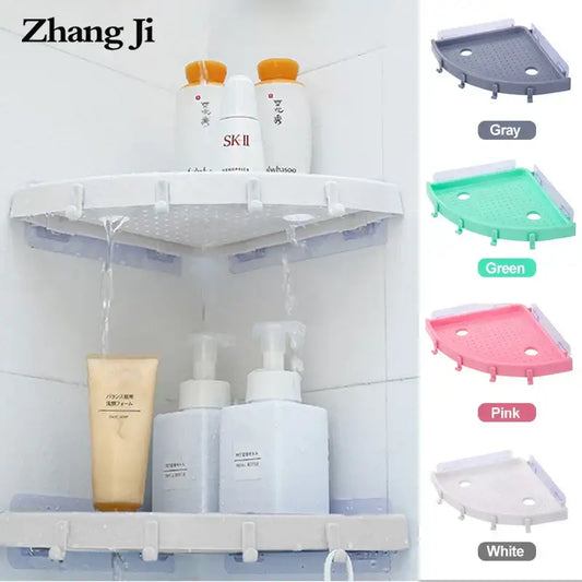 White plastic corner bathroom shelf organizer caddy with perforated top and hook attachments for bathroom use