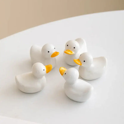 White porcelain duck chopstick holder tray with bright yellow beaks black eyes ceramic dining room dish