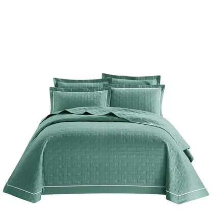 Teal quilted cotton coverlet bedspread set with subtle woven texture and white piping for bedroom decorbites decor