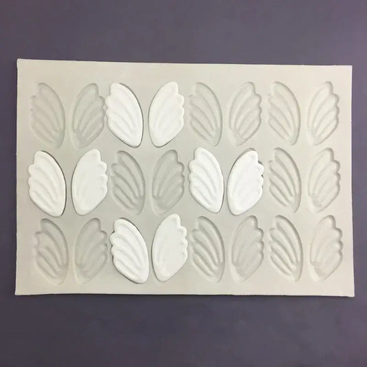 White silicone cake mold with three rows of detailed swan neck decorbites 3d wings cavities for decoration