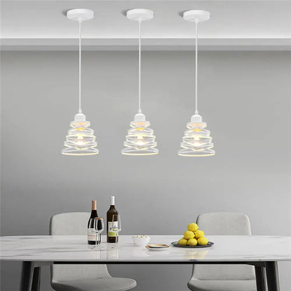 Three white pendant lights with spiral glass shades feature decorbites iron cage ring design for kitchen decor