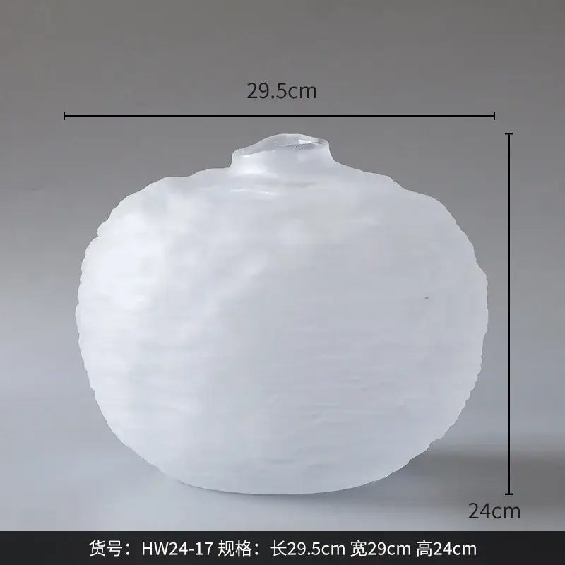 A frosted white glass pleats vase with a rounded textured surface for living room flower decor