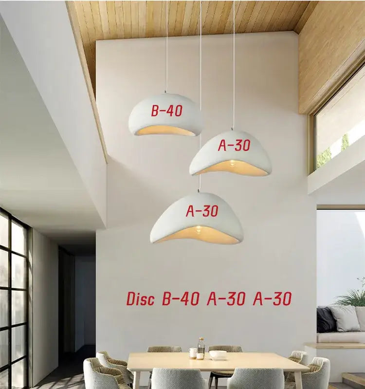 White handmade wabi sabi pendant lamp with three ceramic domes red lettering and warm interior lighting for dining room decorbites