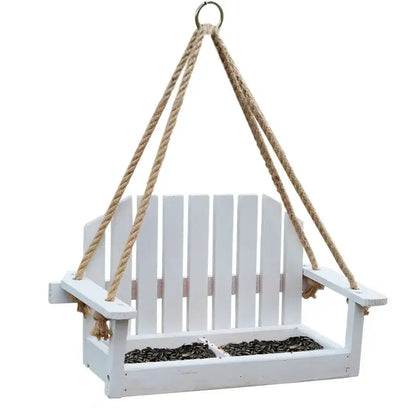 White wooden adirondack bird feeder chair made of wood with natural rope for hanging in garden decor