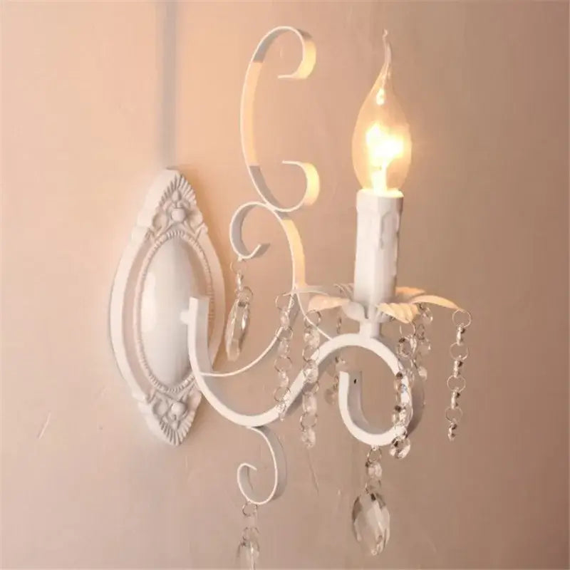 White wrought iron wall lamp with crystal deco loft droplets and candle-style bulb for bedroom decorbites crystal deco use
