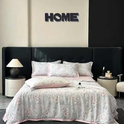 A soft light gray cool silk summer quilt set with pink floral embroidery and matching piping by decorbites