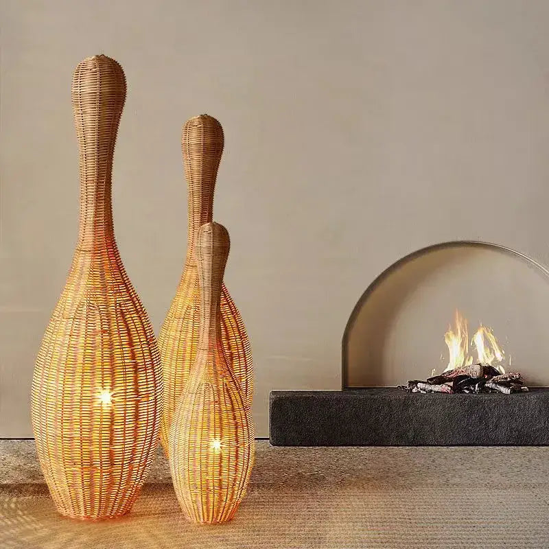 Three woven rattan vases with warm golden-brown hue complement bamboo floor lamp decorbites bamboo floor lamp
