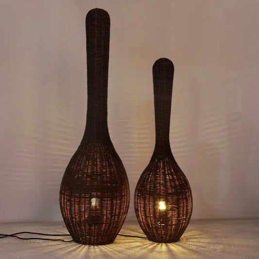 Two dark brown wicker bamboo floor lamps with bulbous bases emitting warm light ideal for living room decorbites floor lamp