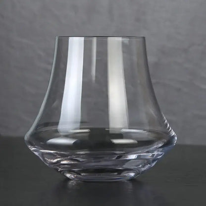 Clear glass crystal whiskey glass tumbler with flared rim and faceted base for dining room spirits by decorbites