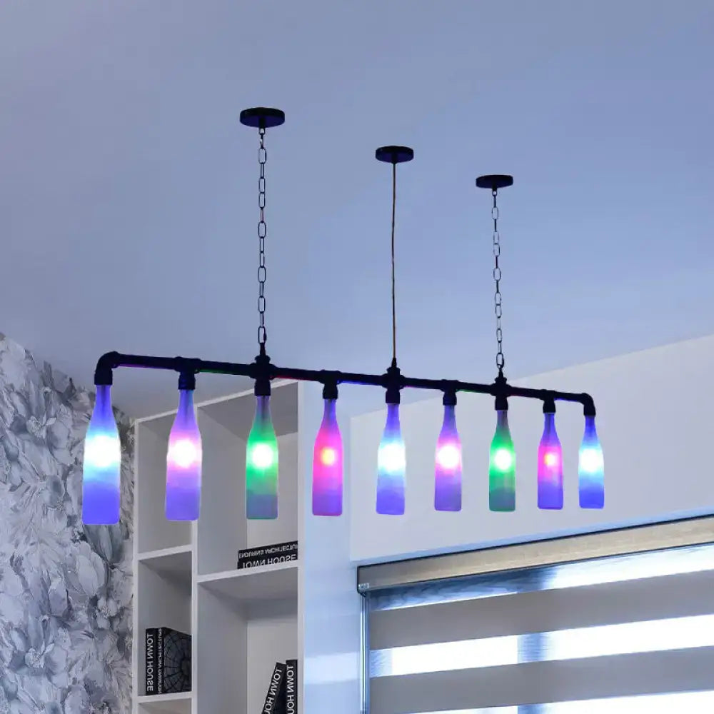 DecorBites™ island pendant light with seven colorful glass bottles on black metal pipe frame featuring chain cord length