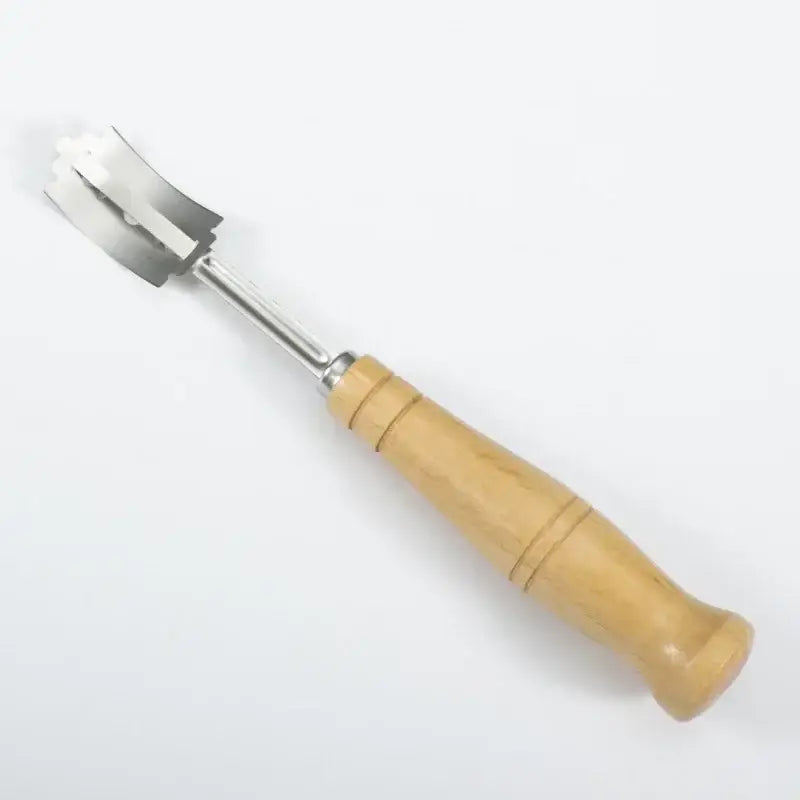 Wooden bread lame cutter with stainless steel blade and wooden handle featuring a leather cover for baking use
