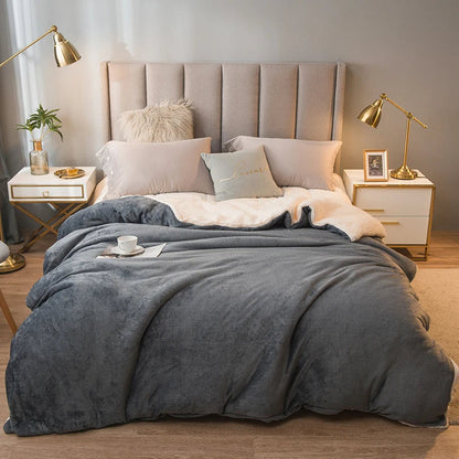 Soft gray wool throw blanket with a cozy textured surface and subtle sheen for winter bed and camping use
