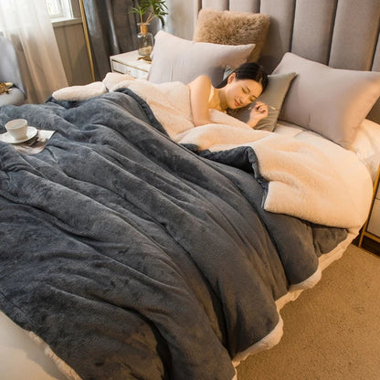 Soft gray and cream two-tone fleece wool throw blanket with plush texture for keeping warm in winter on double beds