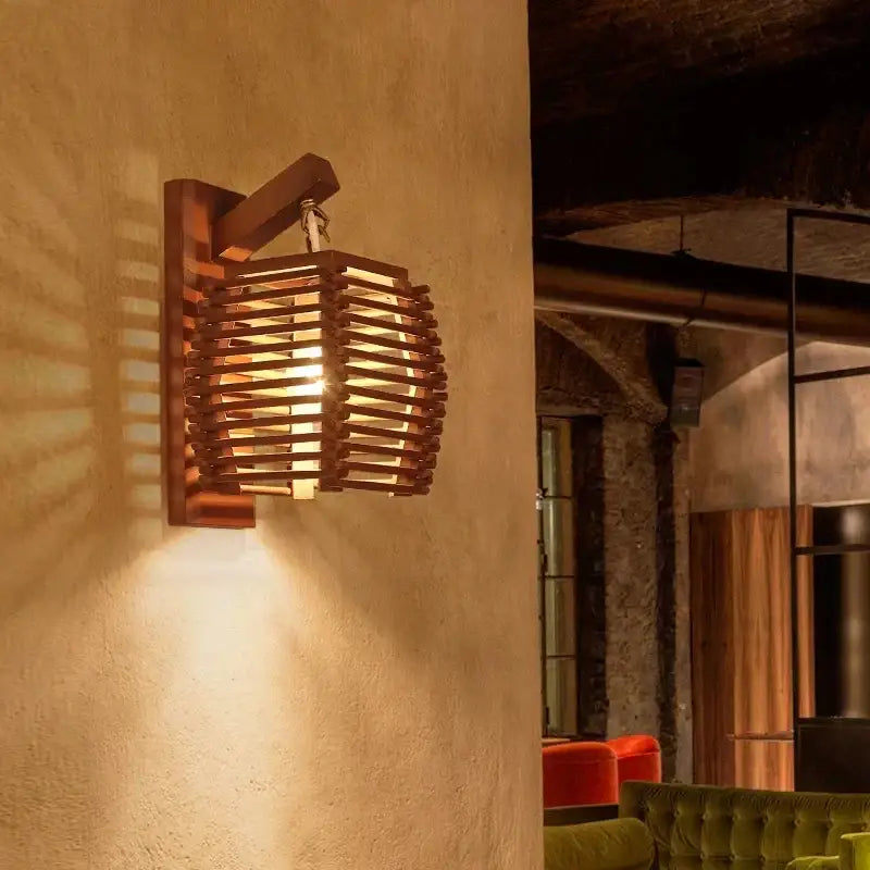 Warm-toned bamboo wall sconce light with woven slat design ideal for corridor and cafe lighting