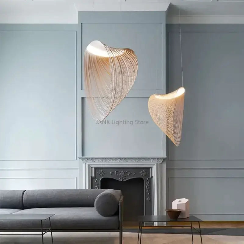 Two elegant warm-toned woven birch wood led pendant lamps by decorbites hang from the ceiling for dining room decor