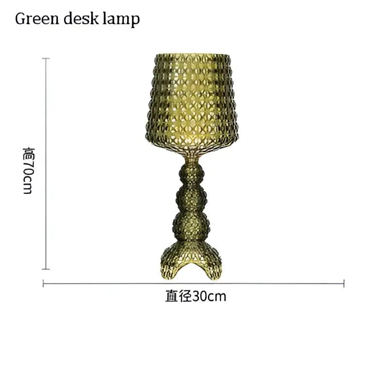 Green glass desk lamp with textured faceted design and bulbous base complementing decorbites acrylic kabuki floor lamp