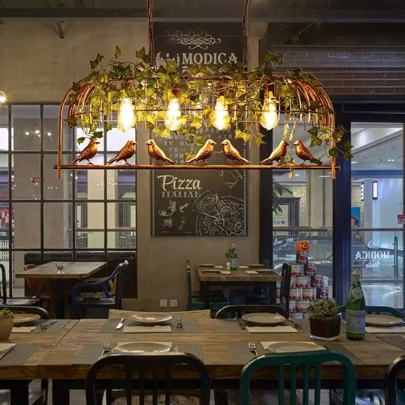 Rustic copper birdcage pendant lights with green ivy, bronze birds, exposed filament bulbs for dining room decorbites birdcage pendant