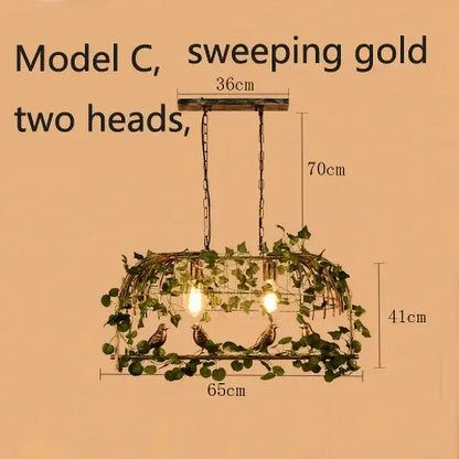 Wrought iron decorbites birdcage pendant lights with sweeping gold two-head design and green vines for dining room