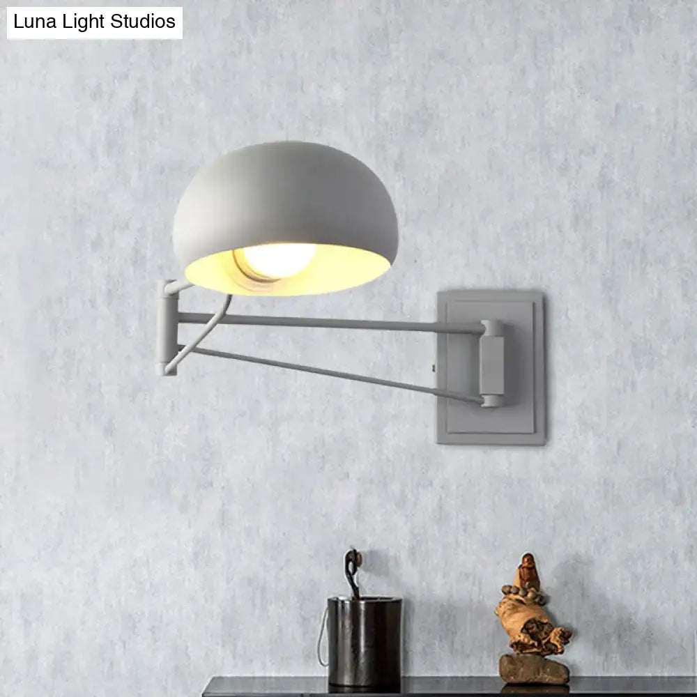 Gray matte-finished adjustable metal wall sconce with dome-shaped bowl shade for bedroom lighting