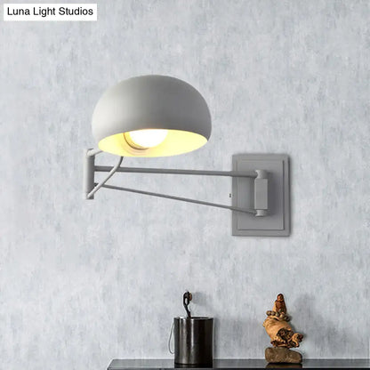 Gray matte-finished adjustable metal wall sconce with dome-shaped bowl shade for bedroom lighting