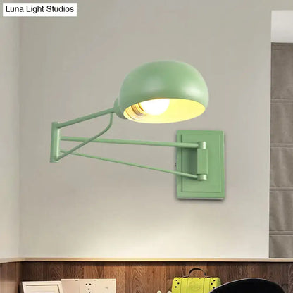 Mint green metal wall sconce with adjustable arm and bowl shade ideal for bedroom lighting and decor