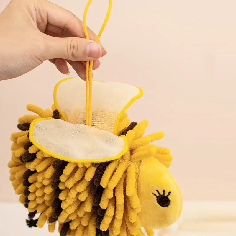 Yellow and brown plush bee shape chenille hand towel with soft bristles and mesh top for bathroom use