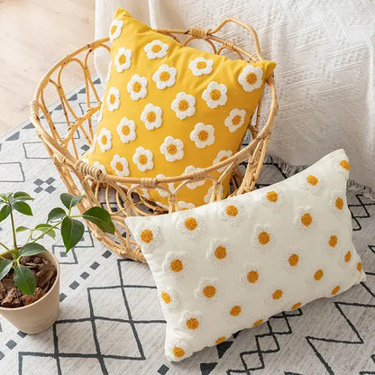 Yellow pillow cover with white and yellow decorbites daisy floral embroidery in a woven basket for living room decor