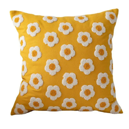 Vibrant yellow pillow cover with raised white and orange daisy floral embroidery by decorbites for living room decor