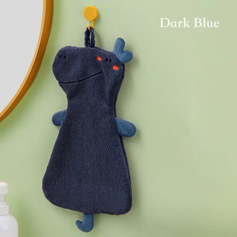 Dark blue plush cartoon animal hand towel with orange embroidered eyes and small antler-like ears by decorbites
