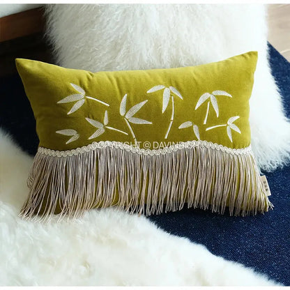 Olive green velvet throw pillow cover with white embroidered bamboo leaves and fringe trim for bedroom decor