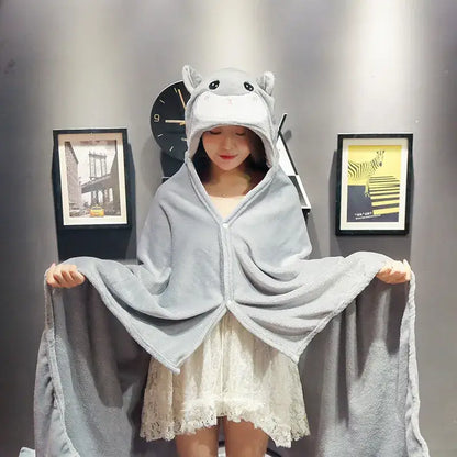 Gray plush hippo hooded cape blanket with soft textured fabric and embroidered facial features for bedroom and office warmth