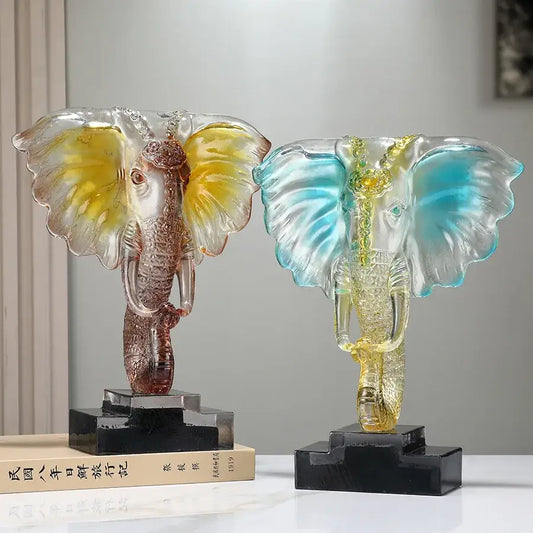 Two translucent decorbites crystal elephant sculptures with yellow rose gold and blue golden accents for home decor