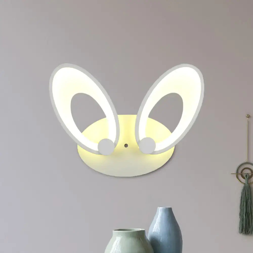Yellow bunny led ceiling light with white finish features illuminated oval ears and soft yellow base for bedroom decor