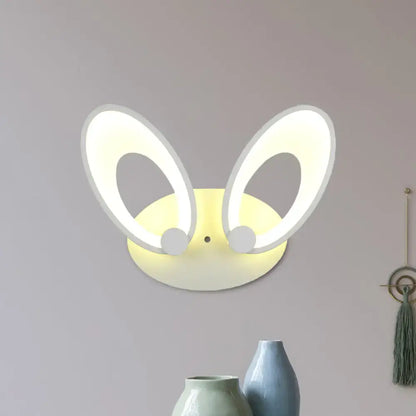 Yellow bunny led ceiling light with white finish features illuminated oval ears and soft yellow base for bedroom decor