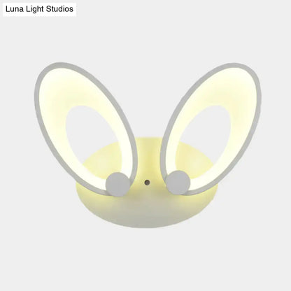 Soft yellow bunny-shaped LED ceiling light with glowing ears gray accents and white finish for bedroom decor