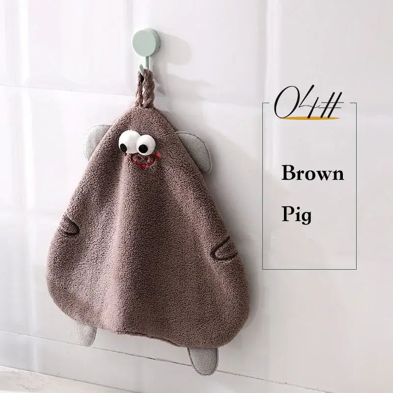 Brown plush cartoon pig hand towel with embroidered eyes and stitched details for bathroom or kitchen decorbites cartoon pig