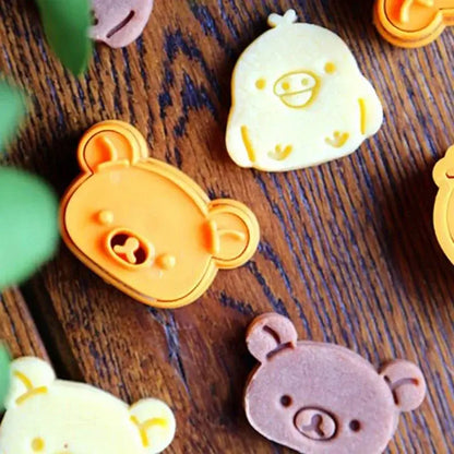 Orange plastic bear sandwich mold cookie cutter with rounded ears smiling face in yellow cute bear baking set