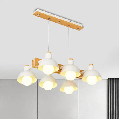 Decorbites dome shade linear chandelier with five white ceramic lampshades and chain cord length suspended from wood beam