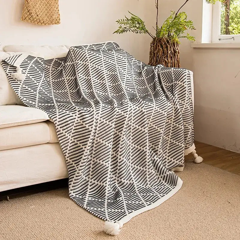 Black and white geometric pattern knitted diagonal stripe sofa blanket with yellow edge and tassels for living room decorbites