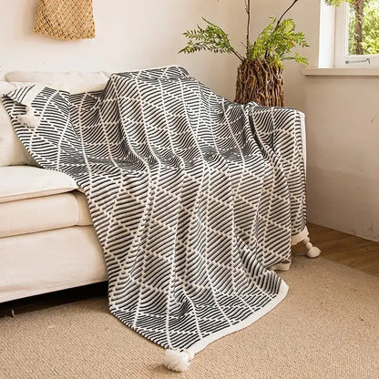 Black and white geometric pattern knitted diagonal stripe sofa blanket with yellow edge and tassels for living room decorbites