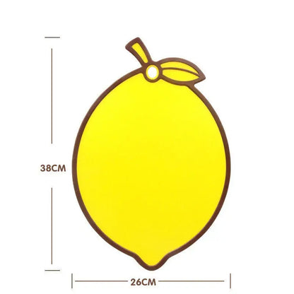 Bright yellow fruit shape silicone chopping board with brown outline and stem detail perfect for kitchen decorbites decor
