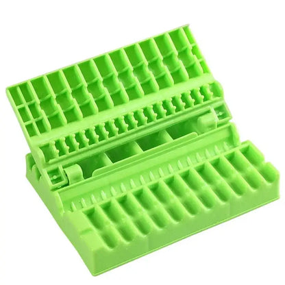 Bright green plastic meat skewer maker with grid slots and interlocking design for bbq meat kababs