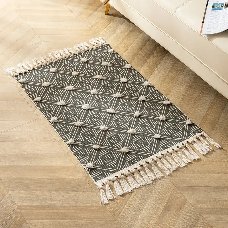 A decorbites handmade nordic gray and cream geometric floor mat with nordic 3d tassel for living room decor