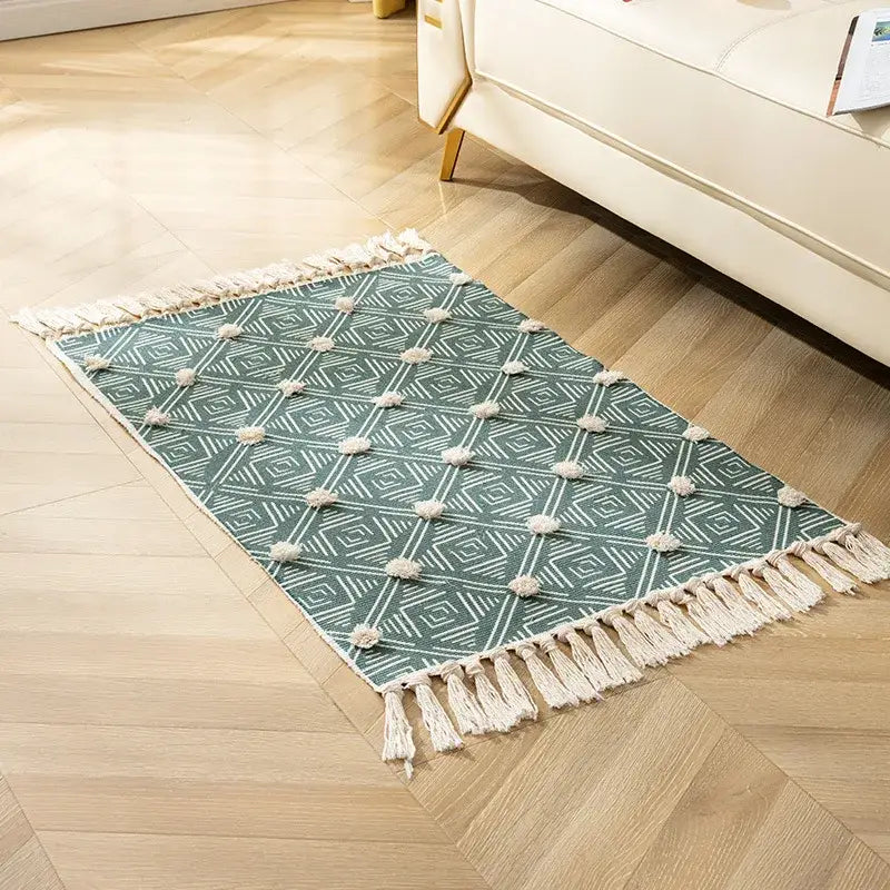 Teal and white geometric floor mat with fluffy pom-poms cream fringe decorbites handmade nordic 3d tassel design