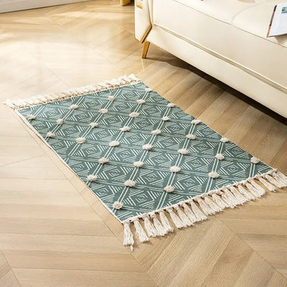 Teal and white geometric floor mat with fluffy pom-poms cream fringe decorbites handmade nordic 3d tassel design