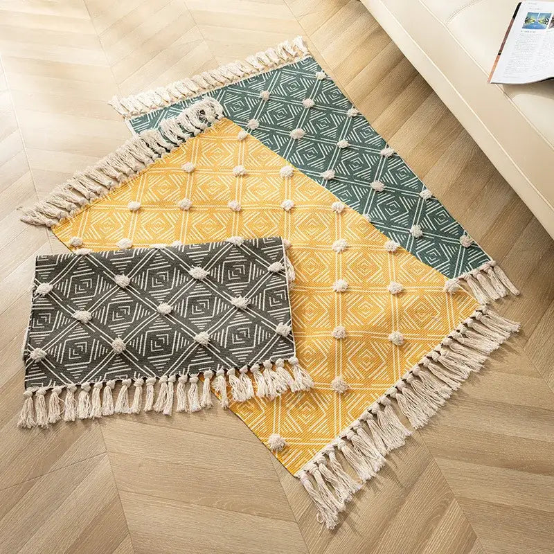 Three rectangular woven floor mats with nordic 3d tassel in mustard yellow teal green and charcoal gray decorbites handmade nordic