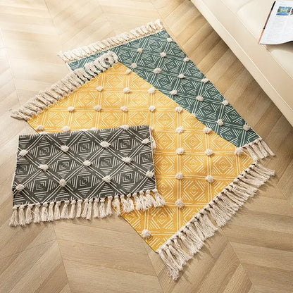 Three rectangular woven floor mats with nordic 3d tassel in mustard yellow teal green and charcoal gray decorbites handmade nordic